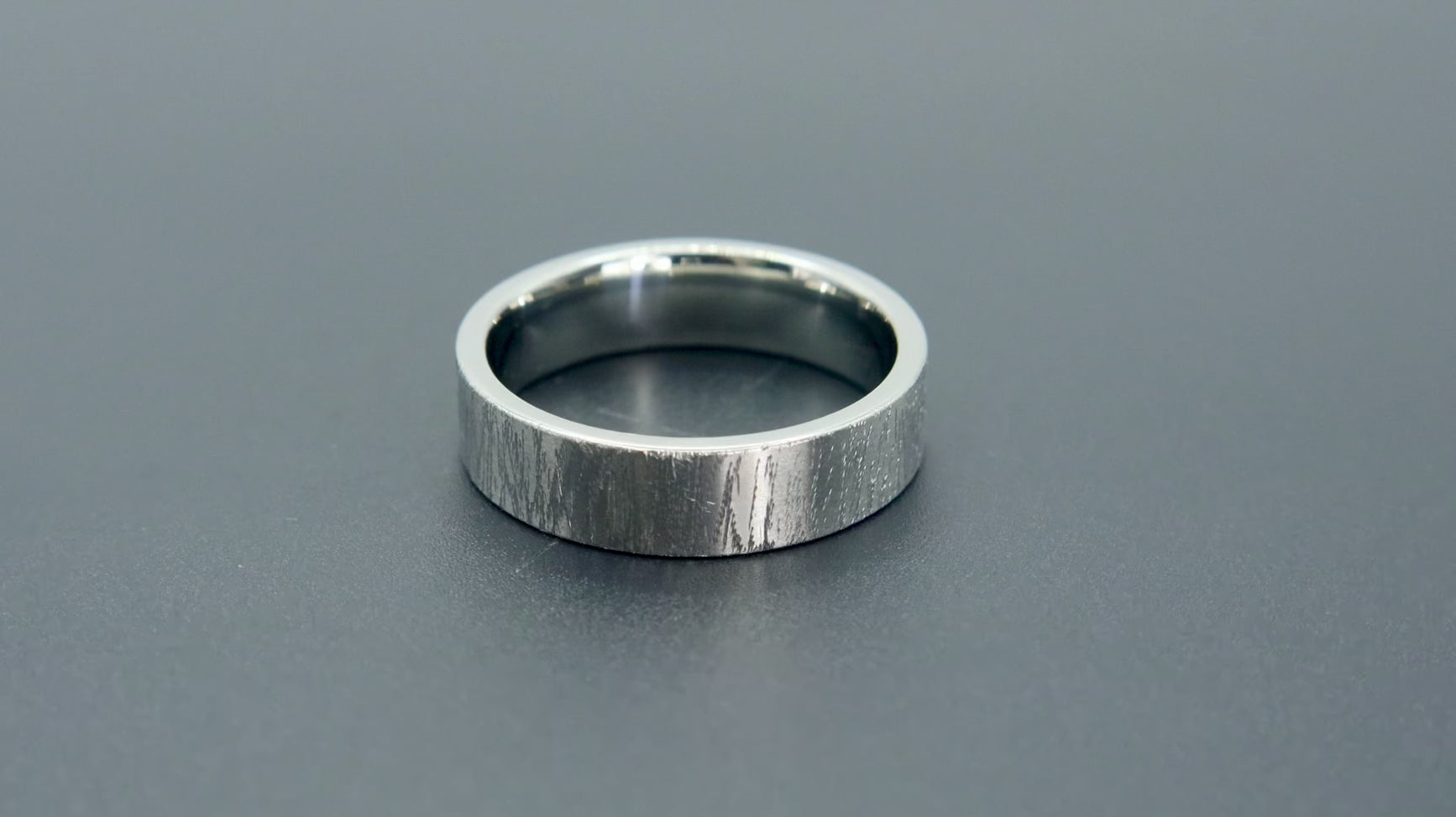 6mm wedding band for men with hand-scored bamboo texture finish, flat profile, polished interior, made in Utah