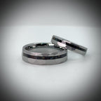 Faceted tungsten wedding ring with black tourmaline and 14k gold inlay in a 2mm offset channel