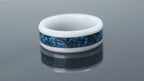 Ceramic ring with textured blue chrysocolla and silver leaf forming a wave-like pattern