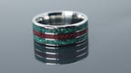 Tungsten ring with textured inlay of chrysocolla and cinnabar forming a rich, layered surface