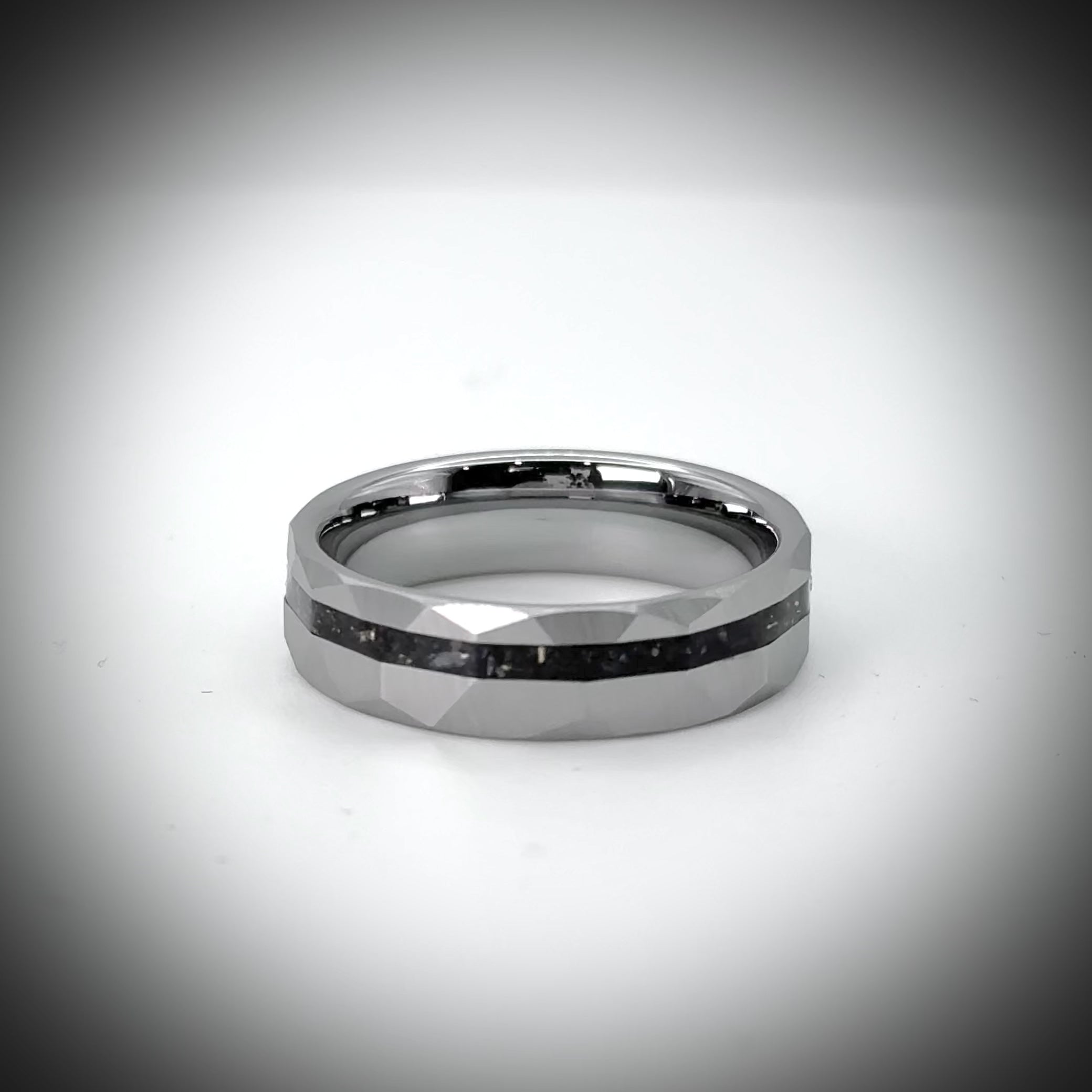 Faceted tungsten wedding ring with black tourmaline and 14k gold inlay in a 2mm offset channel