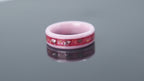 Pink ceramic sea glass ring worn on hand with gold leaf accents and soft ocean tones