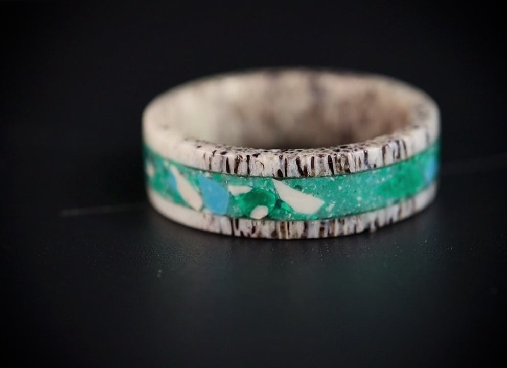 Tidehorn deer antler ring featuring a crushed Larimar inlay with vibrant Caribbean blue tones and natural antler texture.