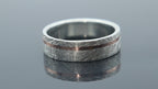 Silver ring with meteorite inspired texture and fine rose gold line creating depth and contrast