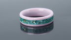 Ceramic ring with pink base, teal inlay and gold leaf reflecting sunset and ocean tones