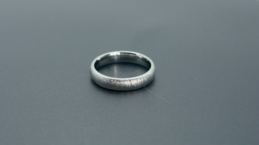 4mm domed women's wedding band with fine vertical diamond burr texture creating a luminous sparkle effect