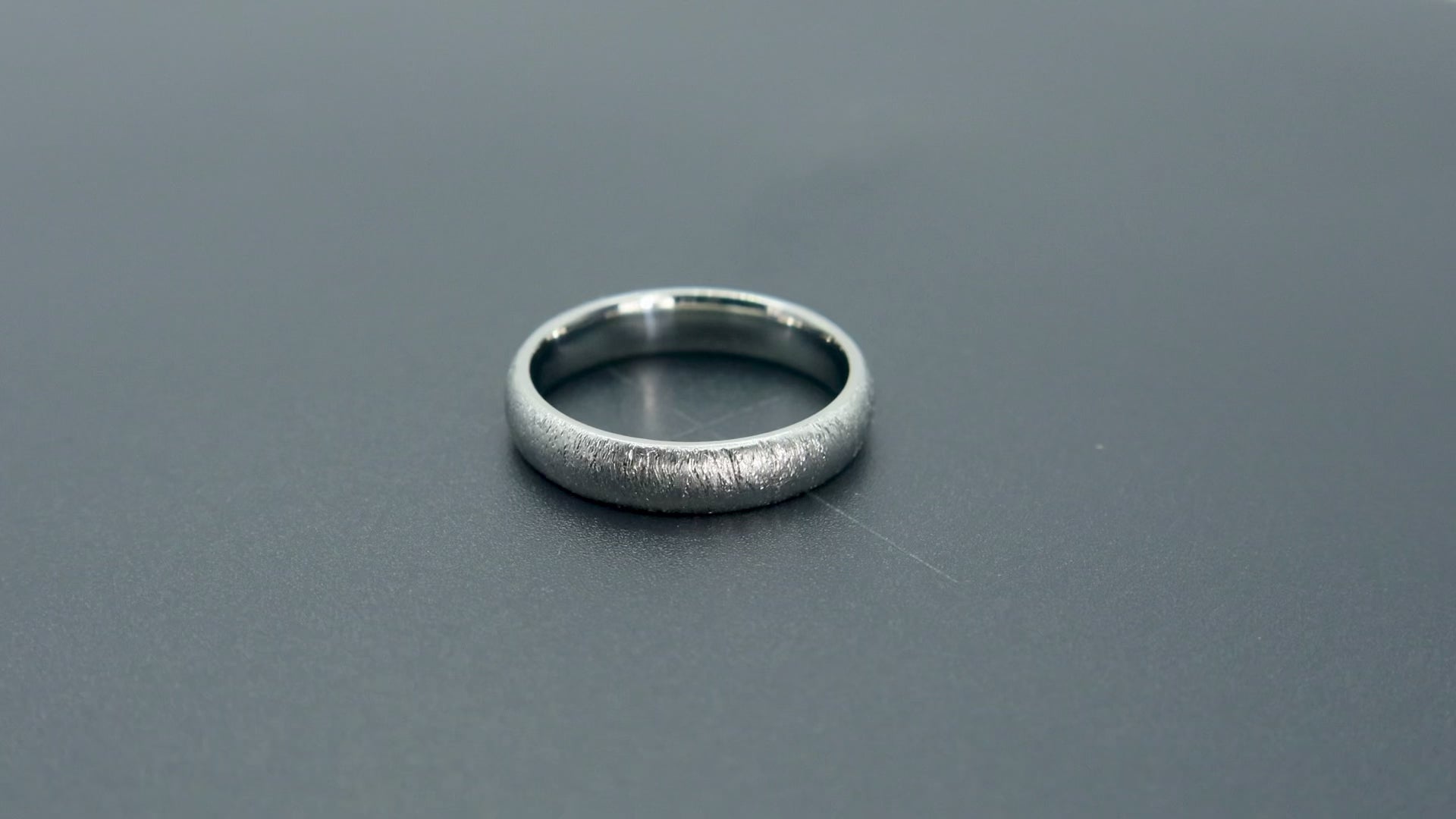 4mm domed women's wedding band with fine vertical diamond burr texture creating a luminous sparkle effect
