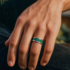 Polished titanium ring with paua abalone inlay and brass guitar strings, handcrafted for everyday wear