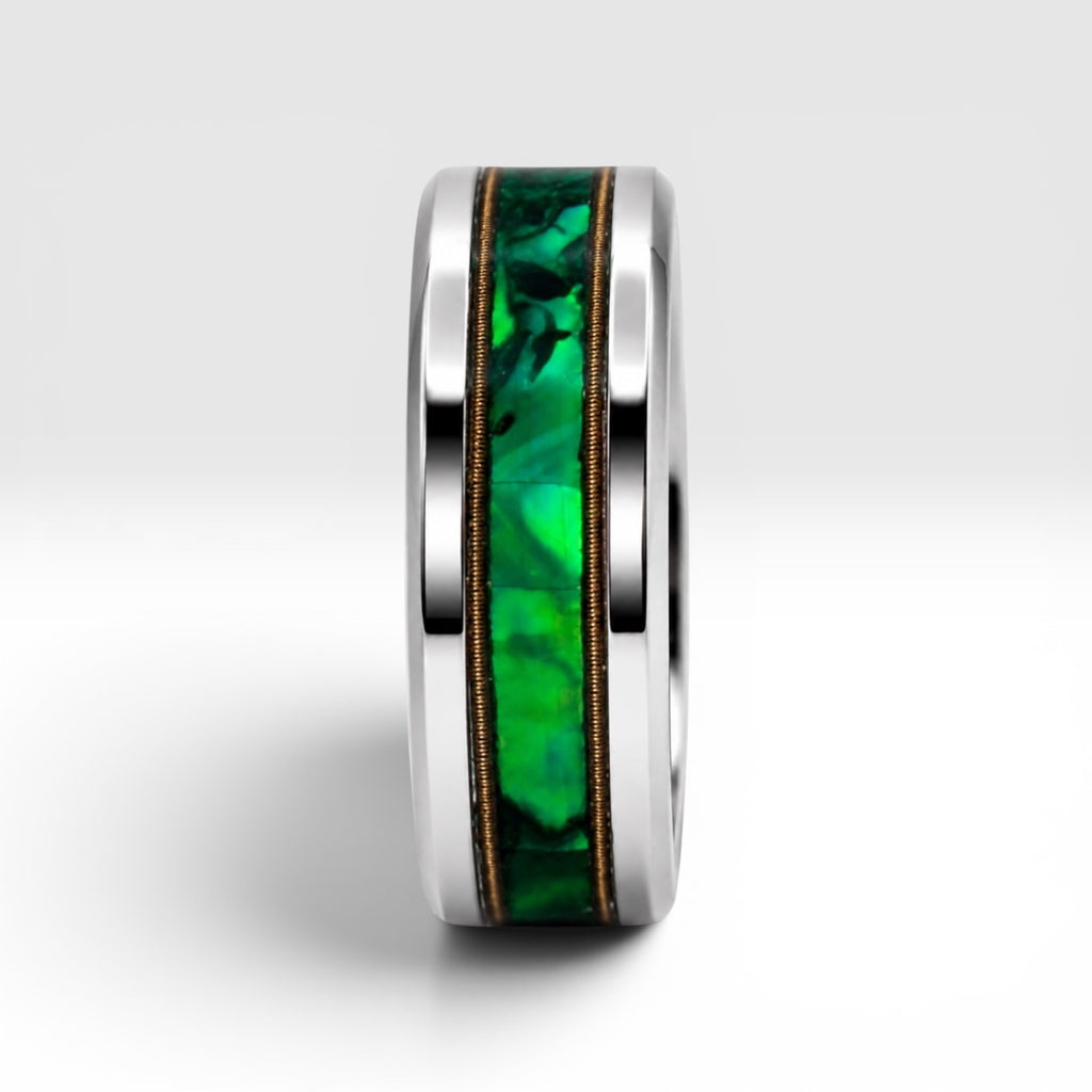 Polished titanium ring with paua abalone inlay and brass guitar strings, handcrafted for everyday wear