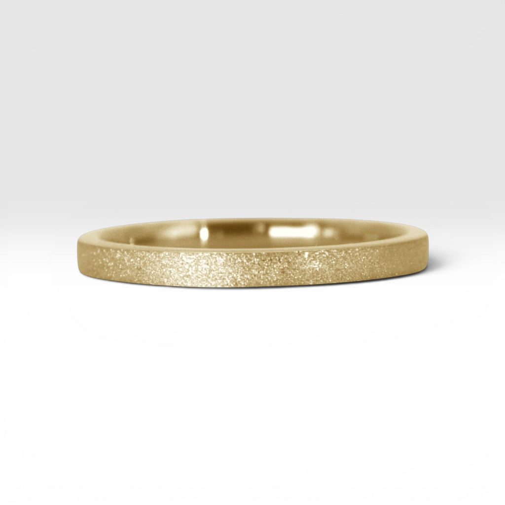 Órbita Luz 2mm gold stackable ring with frosted finish, luminous surface, handcrafted in Utah