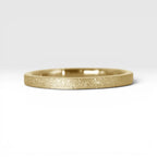 Órbita Luz 2mm gold stackable ring with frosted finish, luminous surface, handcrafted in Utah