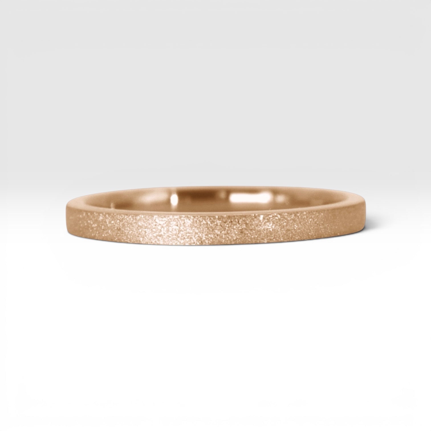 Órbita Luz 2mm rose gold stackable ring with frosted finish, luminous surface, handcrafted in Utah