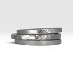 Three titanium stackable rings stacked together showing hammered, frosted, and diagonal textures, 2mm width, handcrafted in Utah