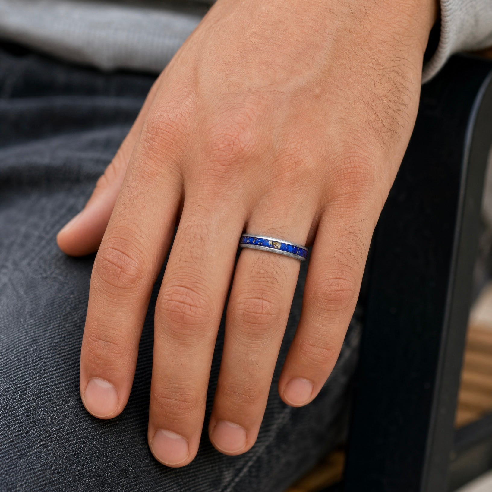 Regalis titanium ring featuring genuine lapis lazuli with natural bronze-colored inclusions and a distressed handcrafted finish.