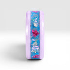Skyblossom pink ceramic ring featuring preserved blue flower petals, pink pressed flowers, and iridescent accents in a handcrafted floral inlay.
