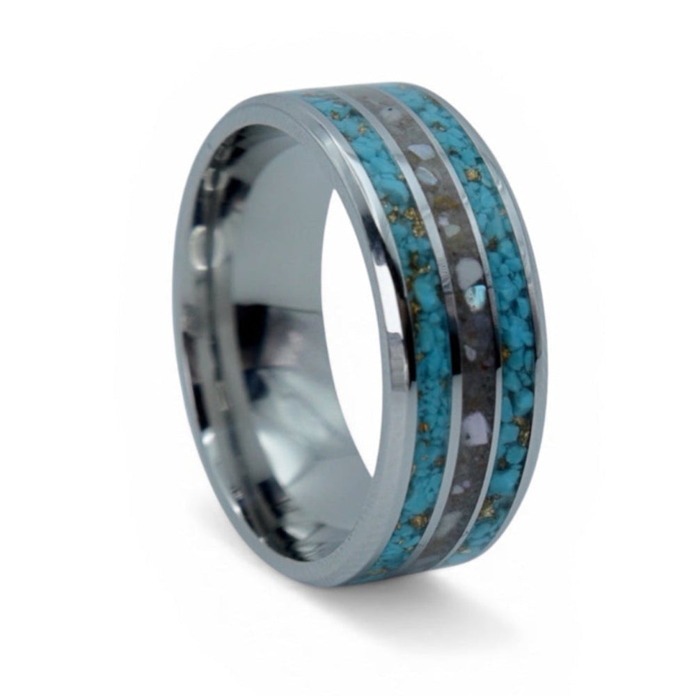 Close-up of tungsten ring with turquoise, mother of pearl and gold leaf showing layered ocean inspired inlay