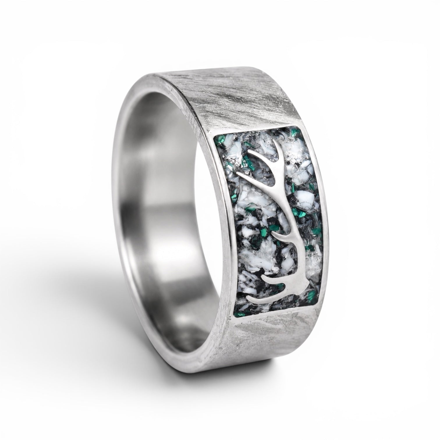 Stagline titanium ring featuring genuine crushed elk tooth, natural malachite inlay, and an antler silhouette with a distressed handcrafted finish.