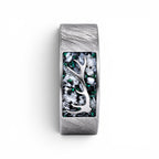 Stagline titanium ring featuring genuine crushed elk tooth, natural malachite inlay, and an antler silhouette with a distressed handcrafted finish.