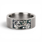 Stagline titanium ring featuring genuine crushed elk tooth, natural malachite inlay, and an antler silhouette with a distressed handcrafted finish.