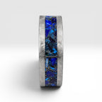 Stellaris titanium ring featuring a mosaic inlay of lapis lazuli, chrysocolla, turquoise, blue goldstone, and brass accents with a distressed finish.