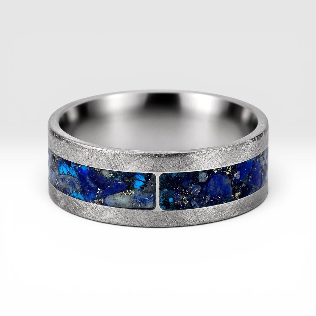 Stellaris titanium ring featuring a mosaic inlay of lapis lazuli, chrysocolla, turquoise, blue goldstone, and brass accents with a distressed finish.