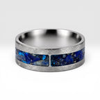 Stellaris titanium ring featuring a mosaic inlay of lapis lazuli, chrysocolla, turquoise, blue goldstone, and brass accents with a distressed finish.