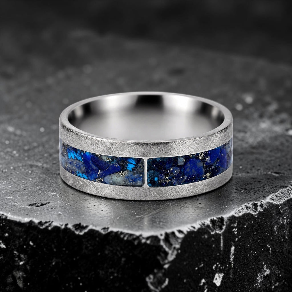 Stellaris titanium ring featuring a mosaic inlay of lapis lazuli, chrysocolla, turquoise, blue goldstone, and brass accents with a distressed finish.