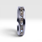 Stellatide titanium ring featuring Bermuda beach sand, Okinawa star sand, and mother of pearl inlay handcrafted by Venus Rings.