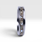 Stellatide titanium ring featuring Bermuda beach sand, Okinawa star sand, and mother of pearl inlay handcrafted by Venus Rings.