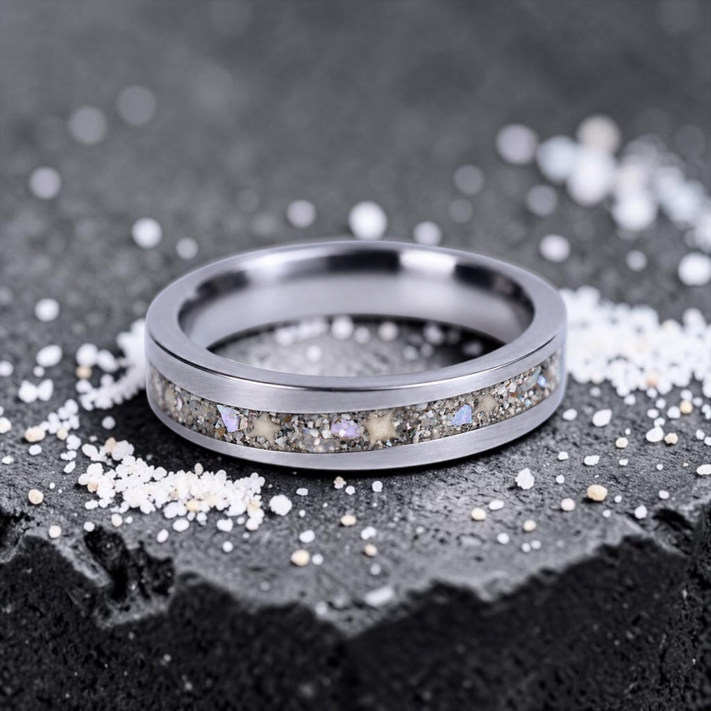 Stellatide titanium ring featuring Bermuda beach sand, Okinawa star sand, and mother of pearl inlay handcrafted by Venus Rings.