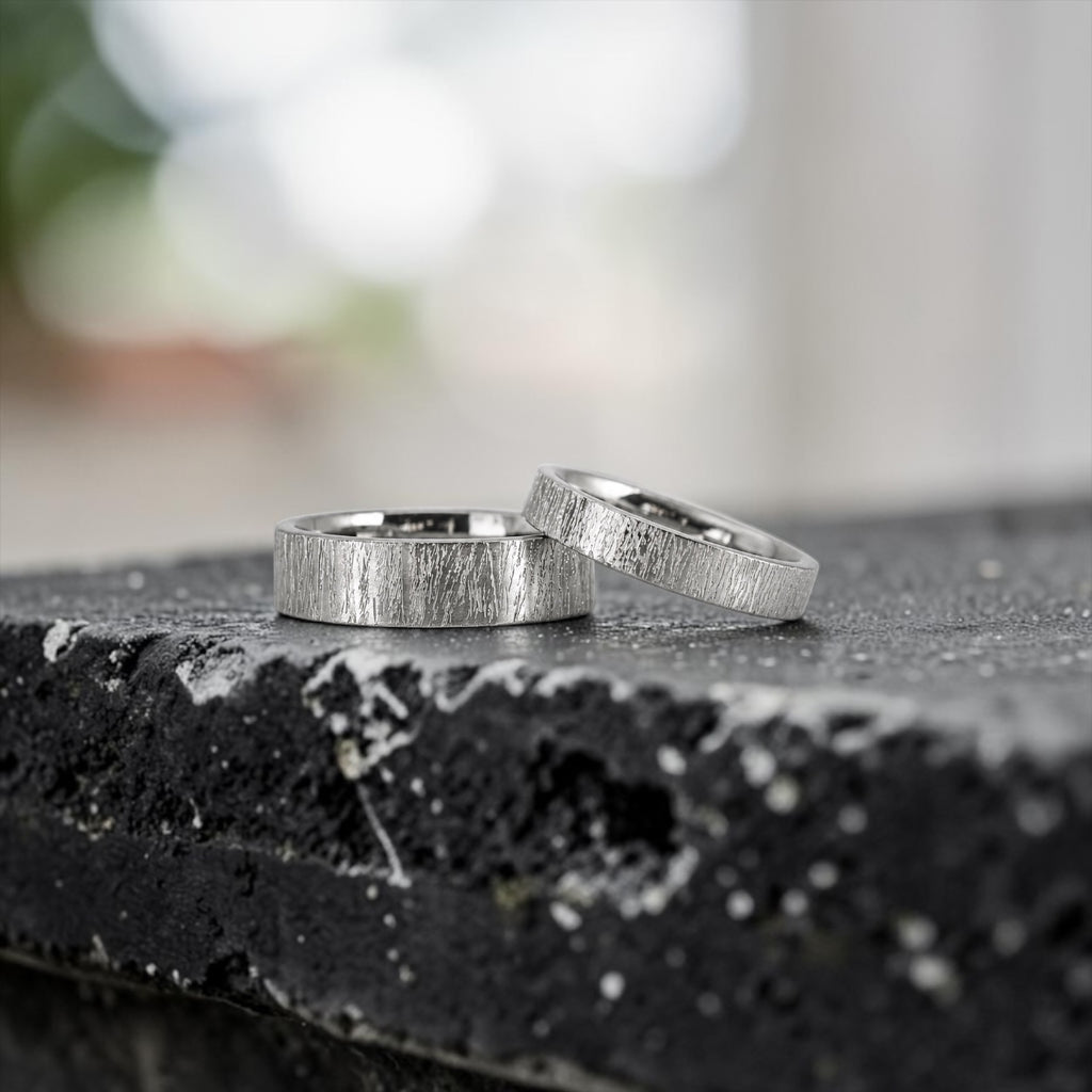 Matching wedding band set with hand-scored bamboo texture finish, 6mm his band and 4mm hers band, handcrafted in Utah