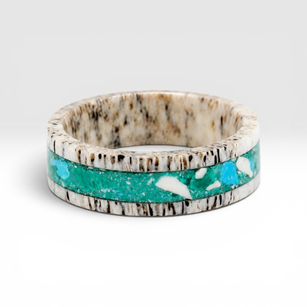 Tidehorn deer antler ring featuring a crushed Larimar inlay with vibrant Caribbean blue tones and natural antler texture.