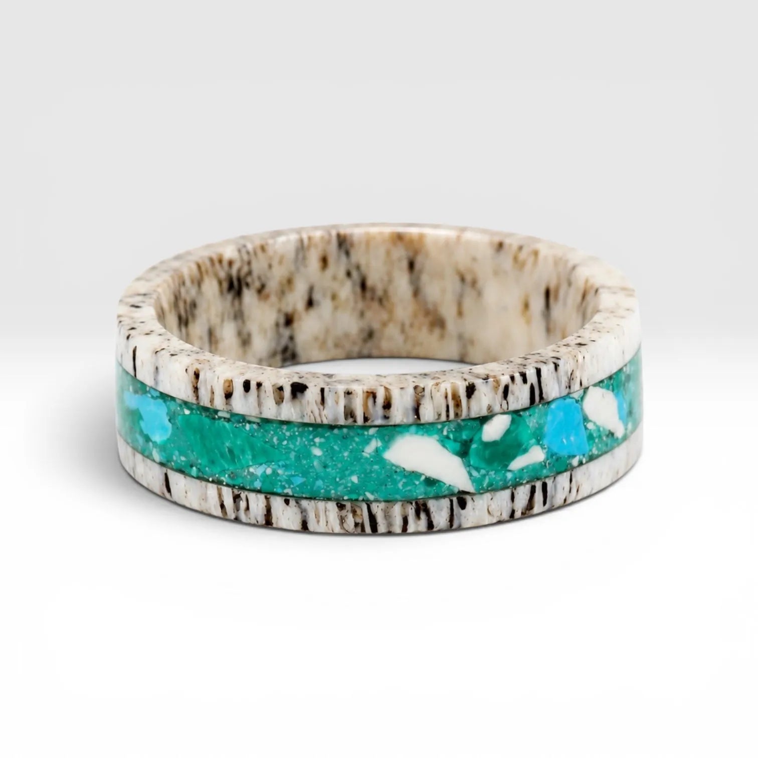 Tidehorn deer antler ring featuring a crushed Larimar inlay with vibrant Caribbean blue tones and natural antler texture.