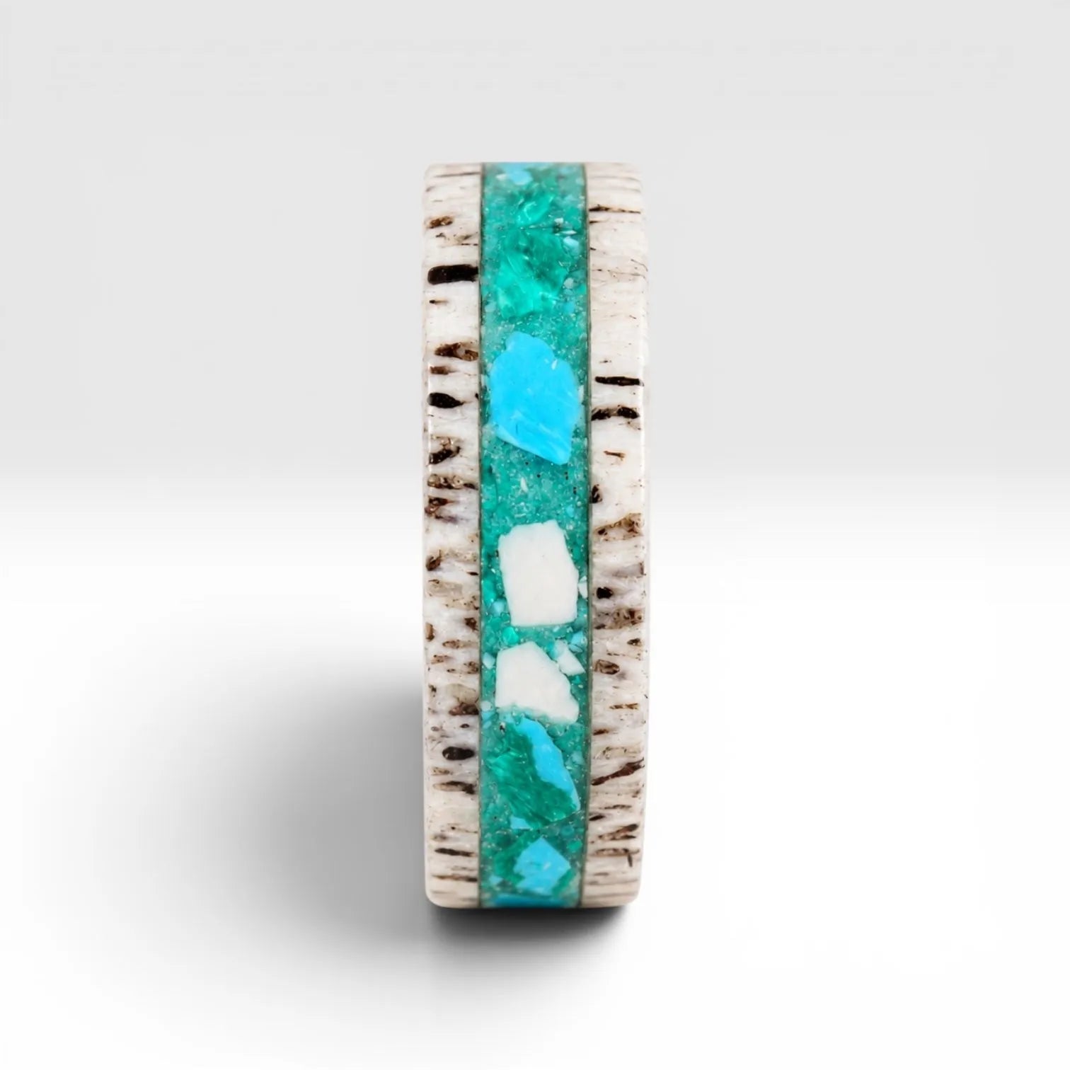 Tidehorn deer antler ring featuring a crushed Larimar inlay with vibrant Caribbean blue tones and natural antler texture.