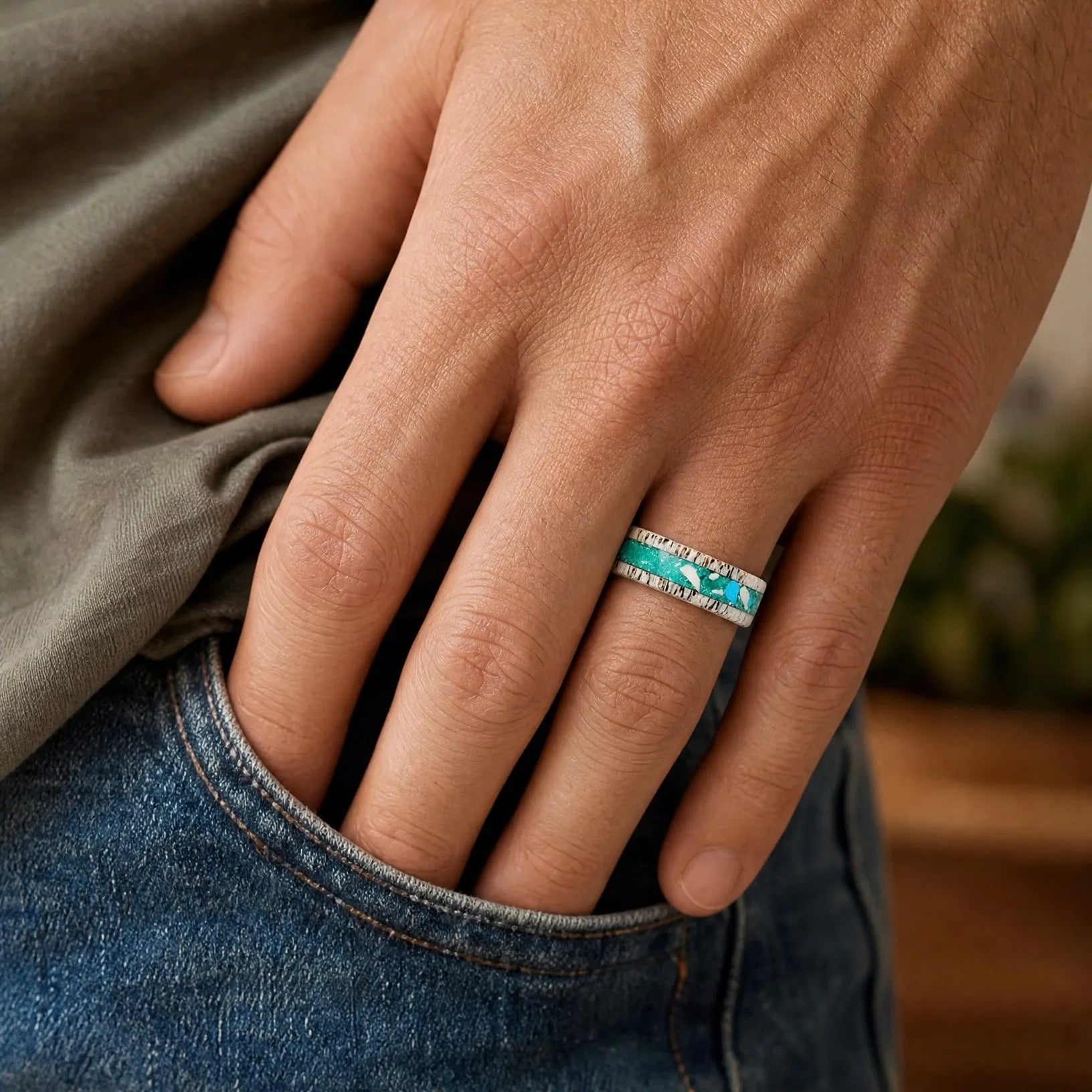 Tidehorn deer antler ring featuring a crushed Larimar inlay with vibrant Caribbean blue tones and natural antler texture.