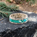 Tidehorn deer antler ring featuring a crushed Larimar inlay with vibrant Caribbean blue tones and natural antler texture.