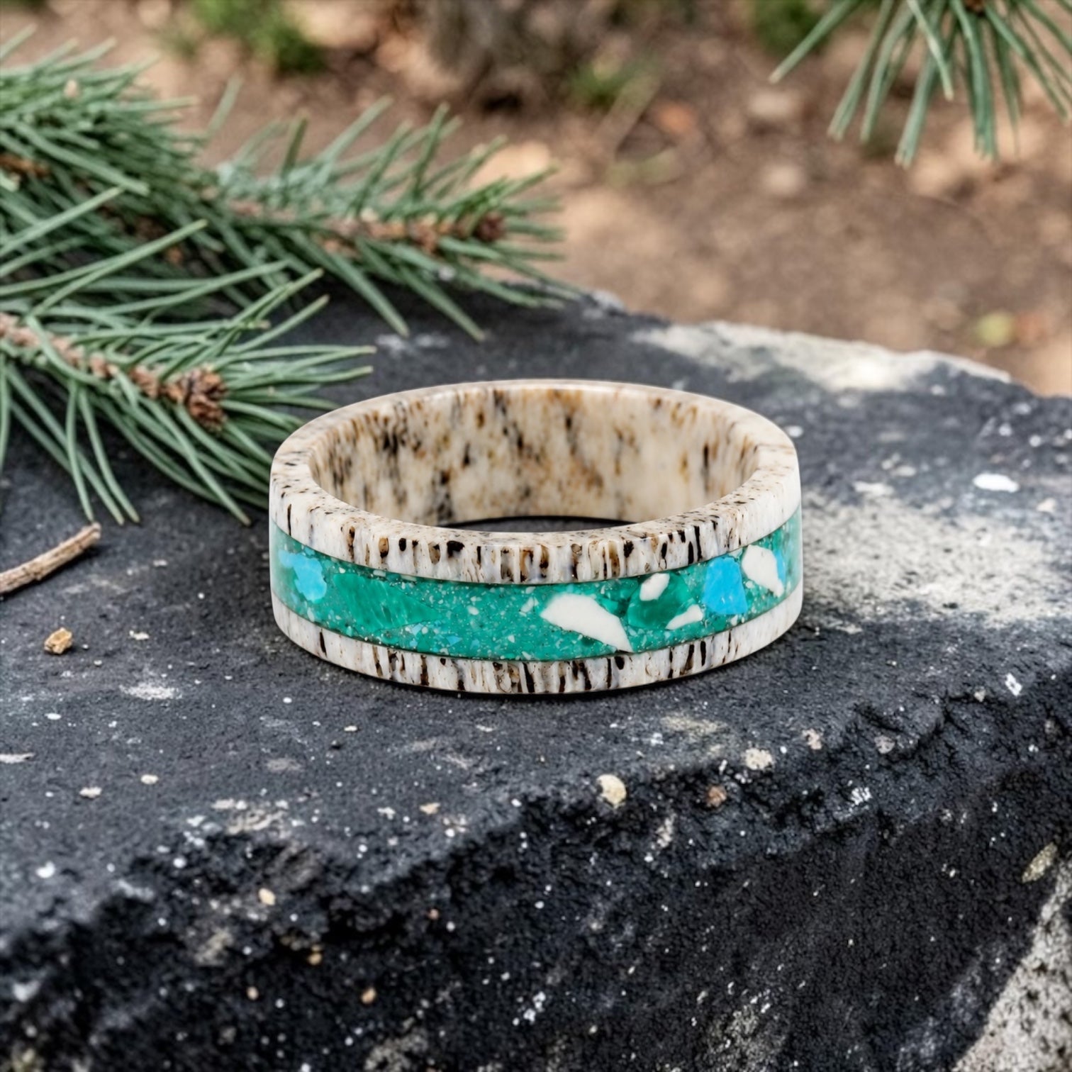 Tidehorn deer antler ring featuring a crushed Larimar inlay with vibrant Caribbean blue tones and natural antler texture.