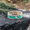 Tidehorn deer antler ring featuring a crushed Larimar inlay with vibrant Caribbean blue tones and natural antler texture.