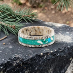 Tidehorn deer antler ring featuring a crushed Larimar inlay with vibrant Caribbean blue tones and natural antler texture.