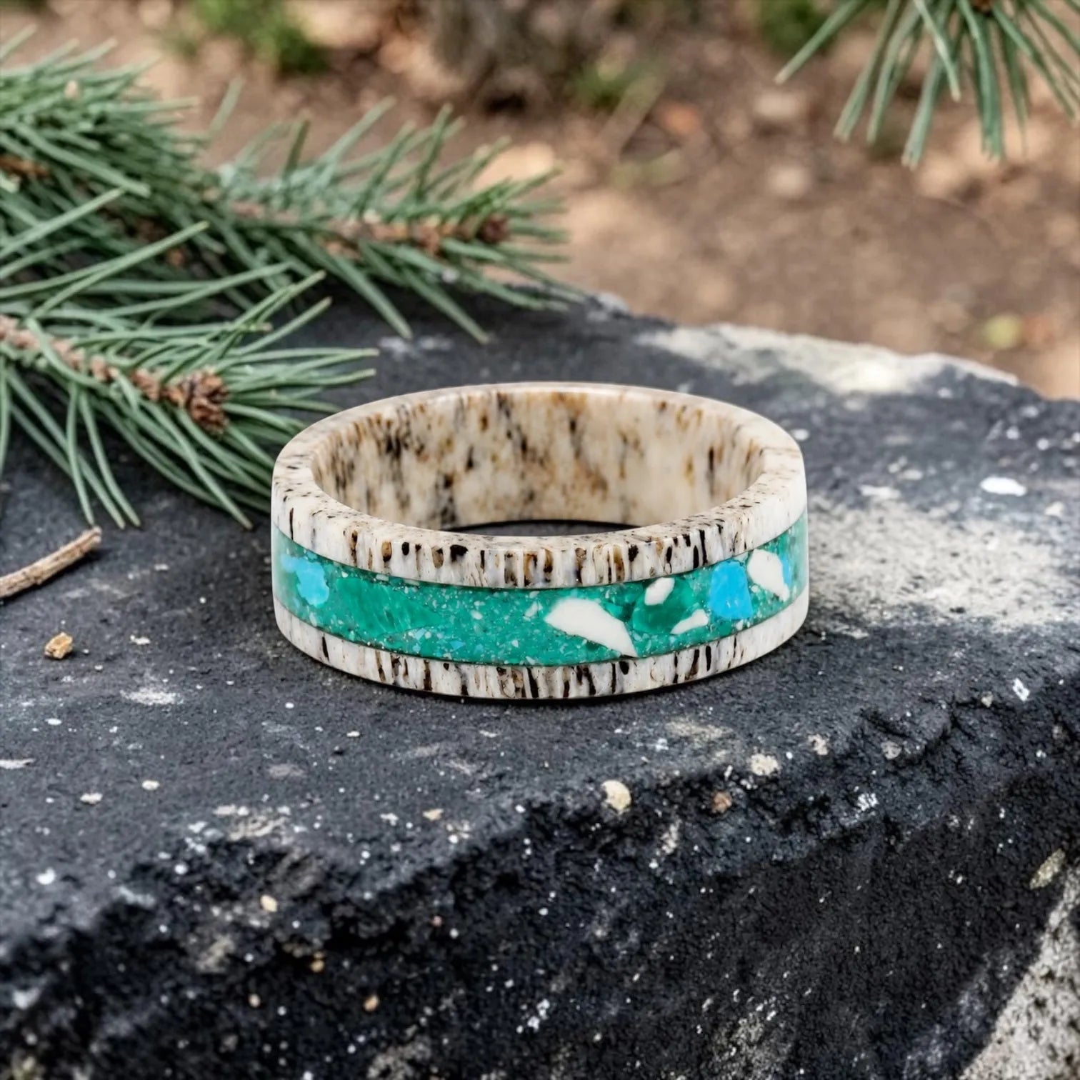 Tidehorn deer antler ring featuring a crushed Larimar inlay with vibrant Caribbean blue tones and natural antler texture.