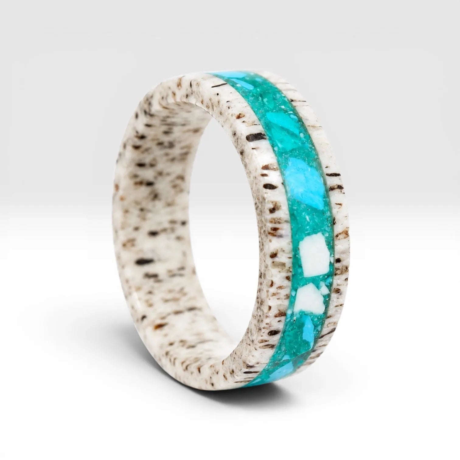 Tidehorn deer antler ring featuring a crushed Larimar inlay with vibrant Caribbean blue tones and natural antler texture.