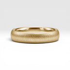 4mm domed gold women's wedding band with fine vertical texture creating a luminous sparkle effect