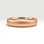 4mm domed rose gold women's wedding band with fine vertical texture creating a luminous sparkle effect