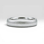 4mm domed sterling silver women's wedding band with fine vertical texture creating a luminous sparkle effect