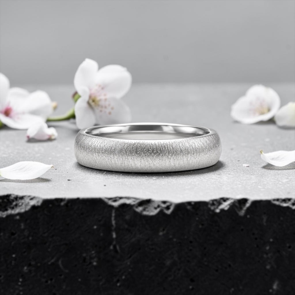 4mm domed women's wedding band with fine vertical texture creating a luminous sparkle effect