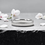 4mm domed women's wedding band with fine vertical texture creating a luminous sparkle effect