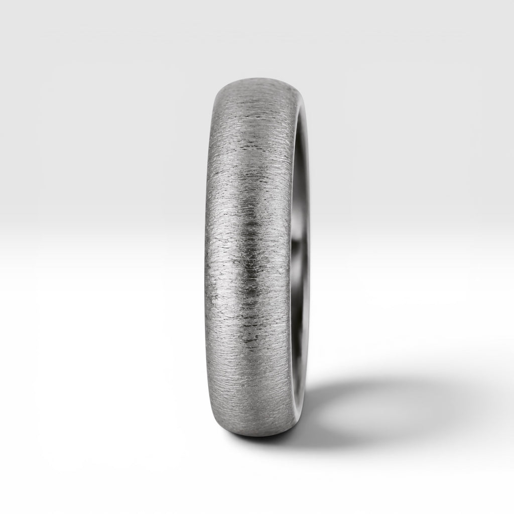 4mm domed women's wedding band with fine vertical texture creating a luminous sparkle effect