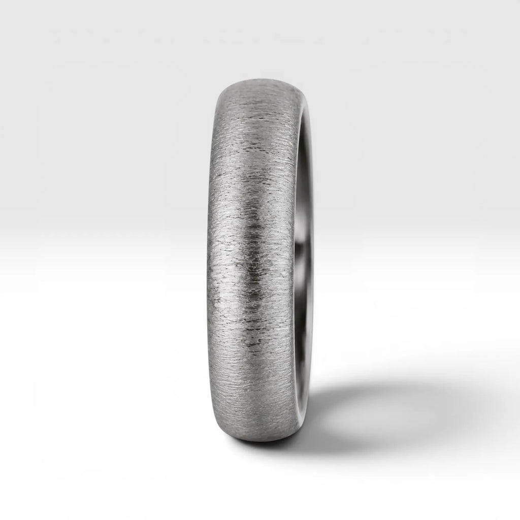 4mm domed women's wedding band with fine vertical texture creating a luminous sparkle effect