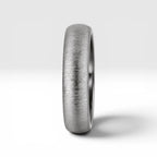 4mm domed women's wedding band with fine vertical texture creating a luminous sparkle effect