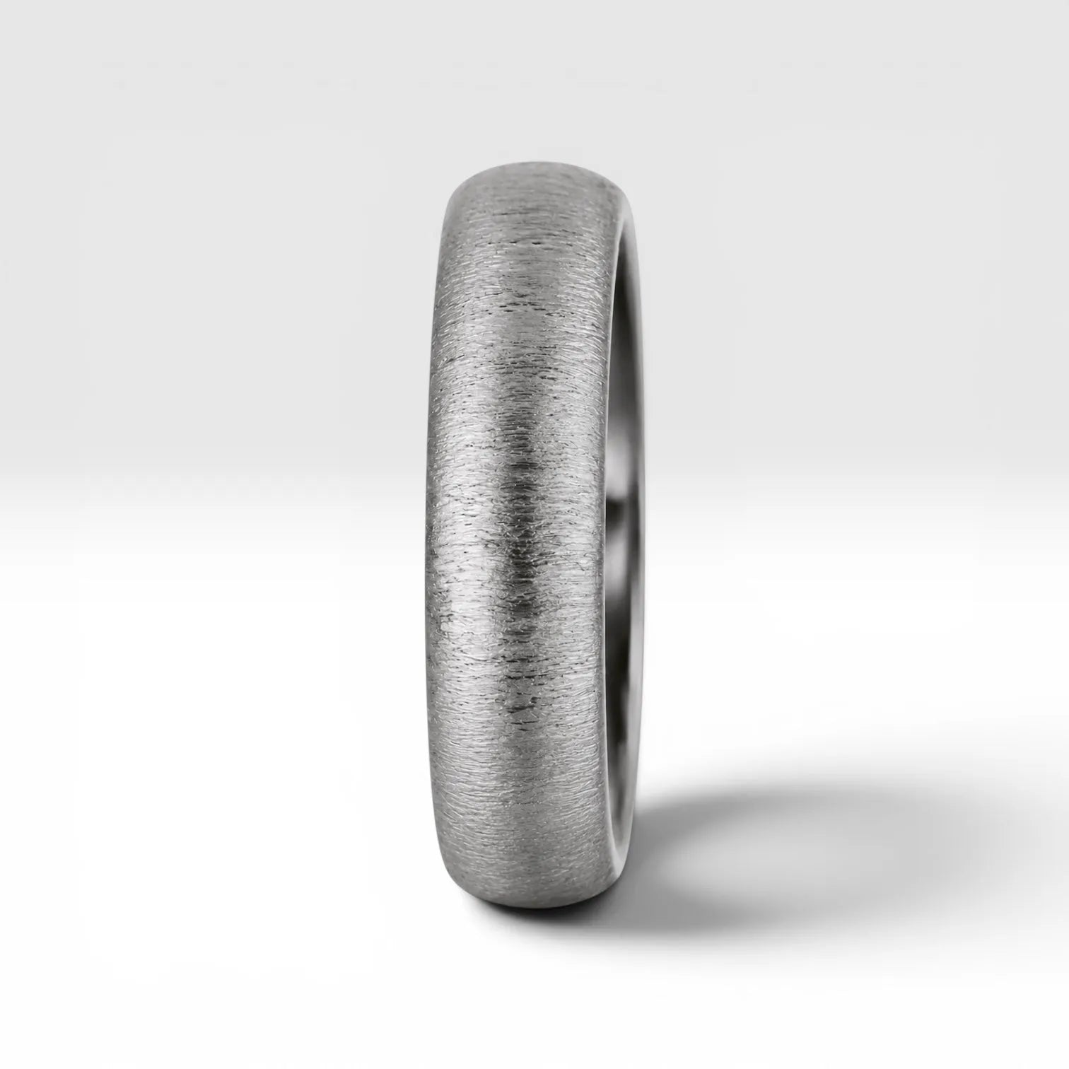 4mm domed women's wedding band with fine vertical texture creating a luminous sparkle effect
